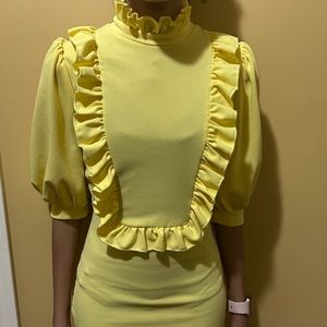 Small Yellow Dress with Ruffle Neckline and Ruffle Detail on Bodice.